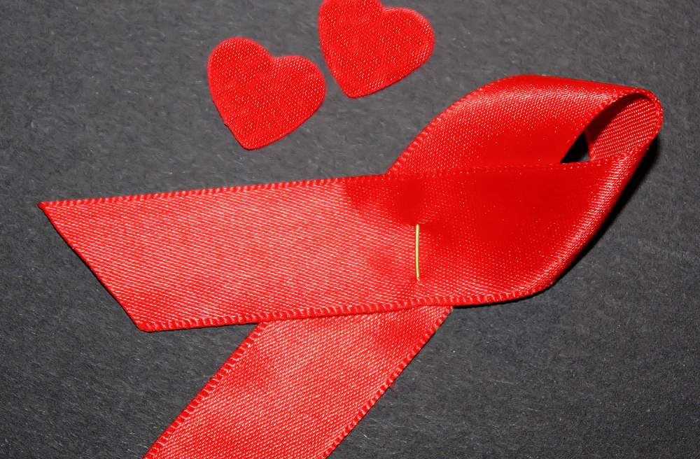 Die rote Schleife ist ein Symbol der Solidarität