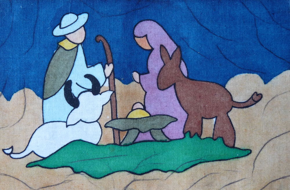 Maria, Josef und das Jesuskind in einer Stoffmalerei aus Nepal