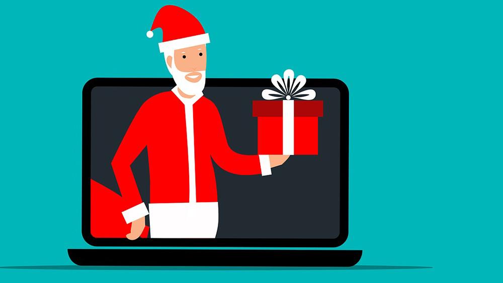 Grafik eines Weihnachtsmanns der aus dem Bildschirm eines Notebooks kommt